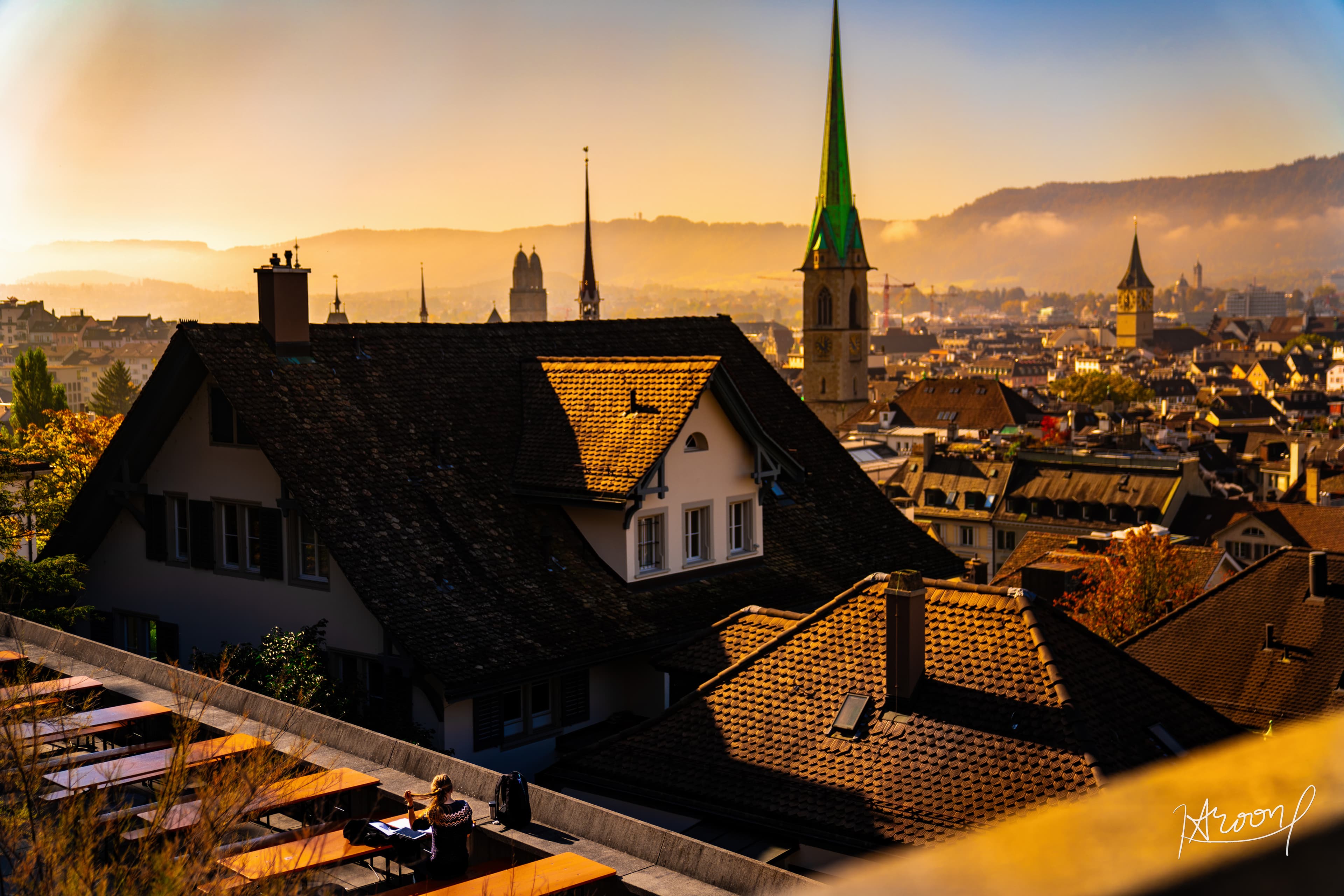 Golden hour cityscape over Zurich rooftops