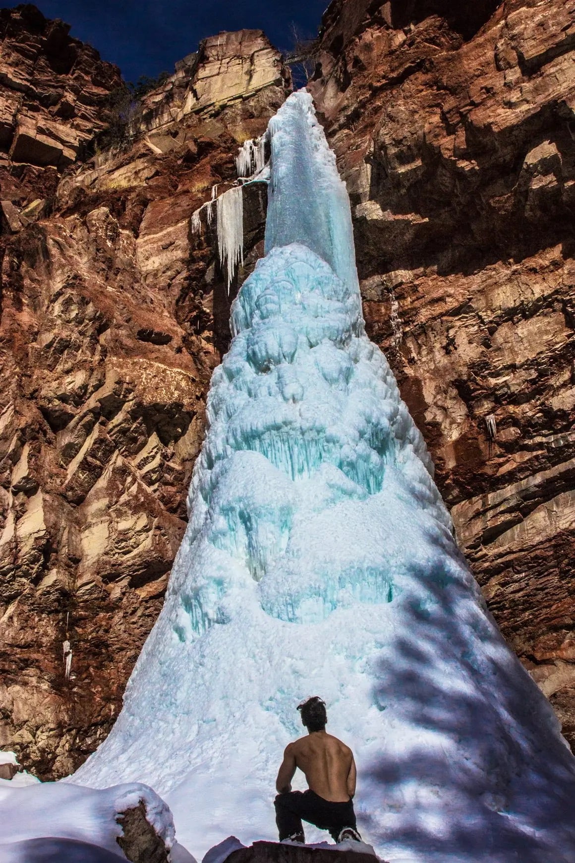Frozen waterfall in red rock canyon